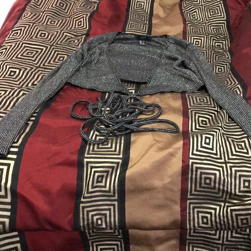 A tie around Half a shirt black and Silver